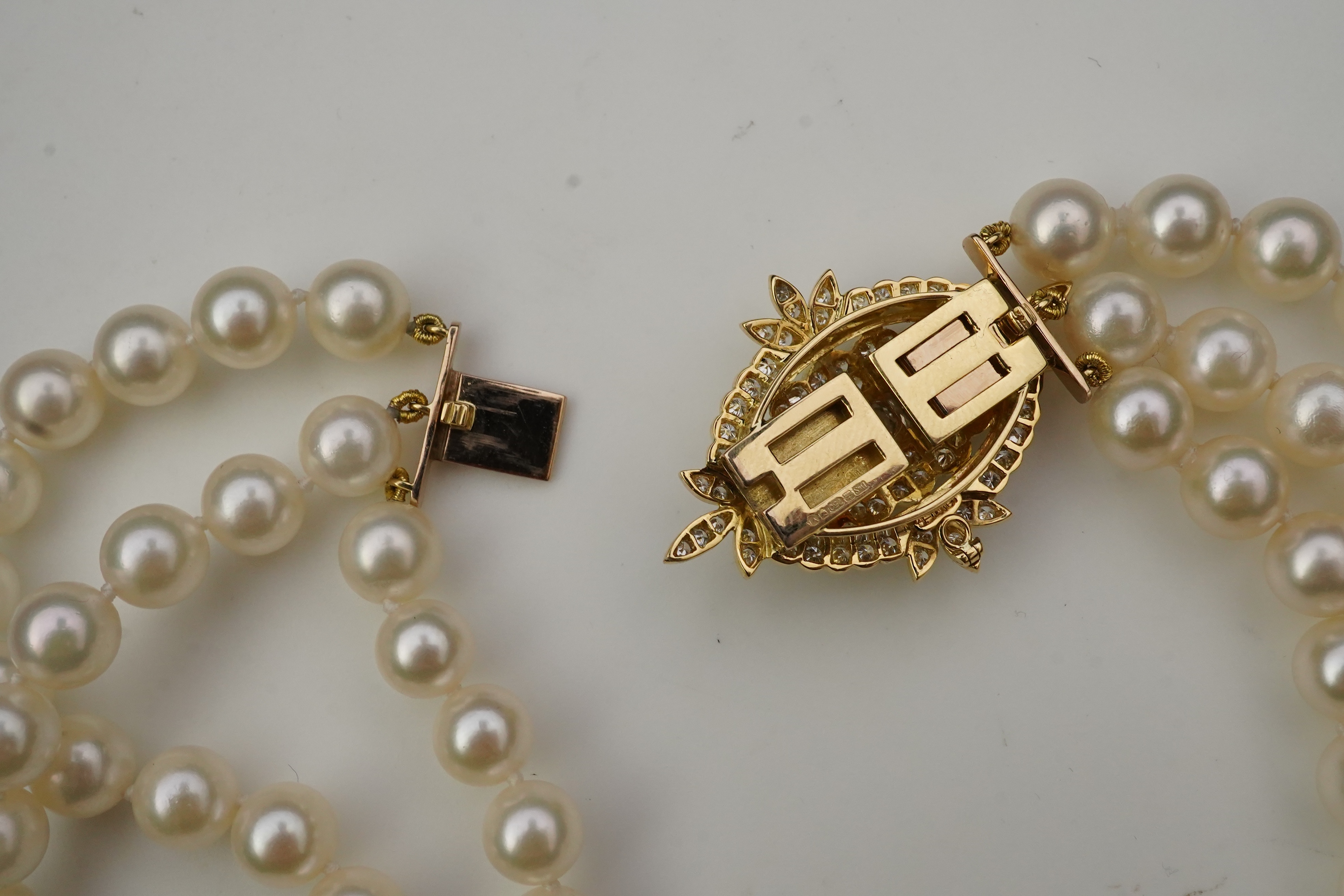 A cultured pearl and diamond necklace/brooch